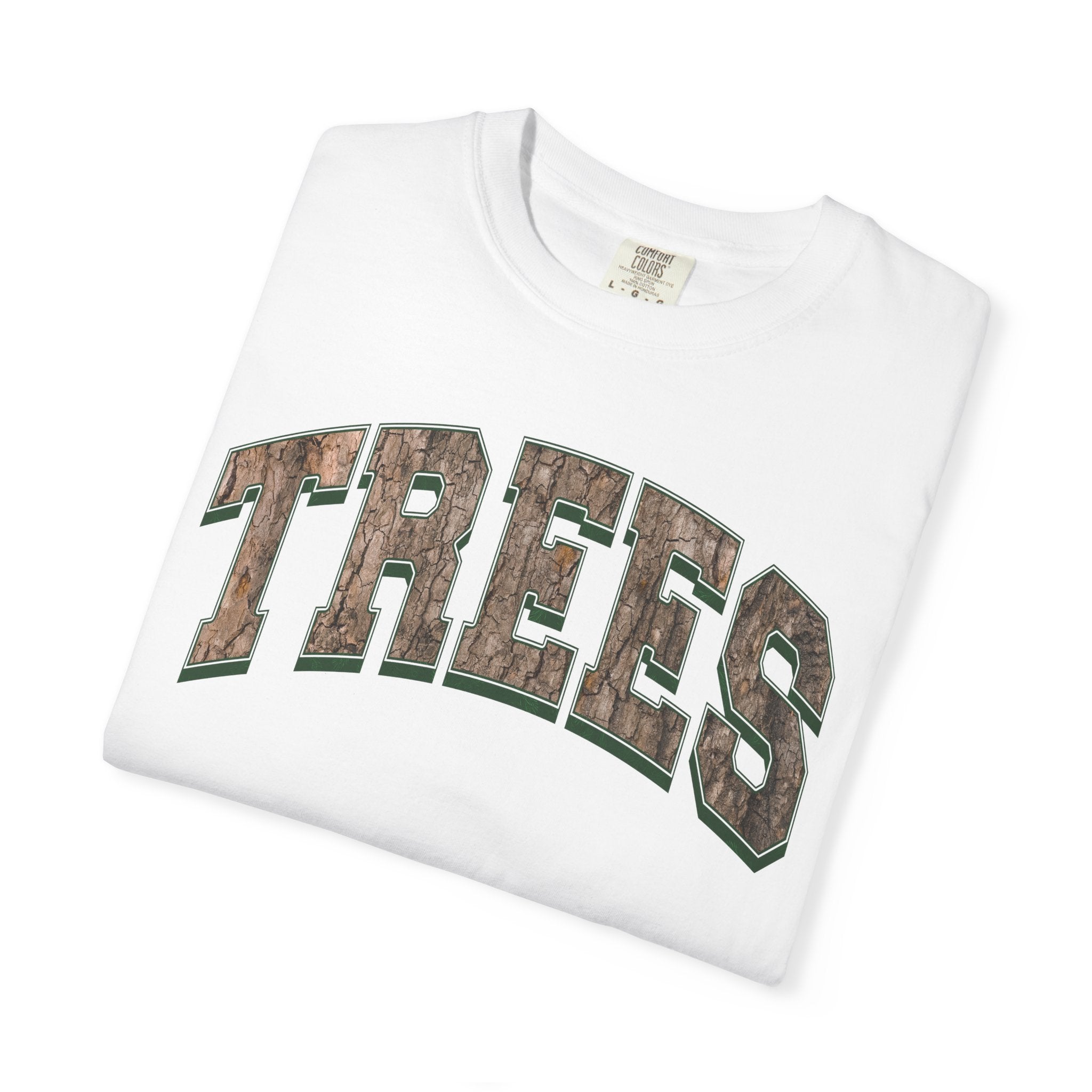 Unisex Comfort Colors t-shirt in white with Trees graphic design in a camo, shirt shown folded