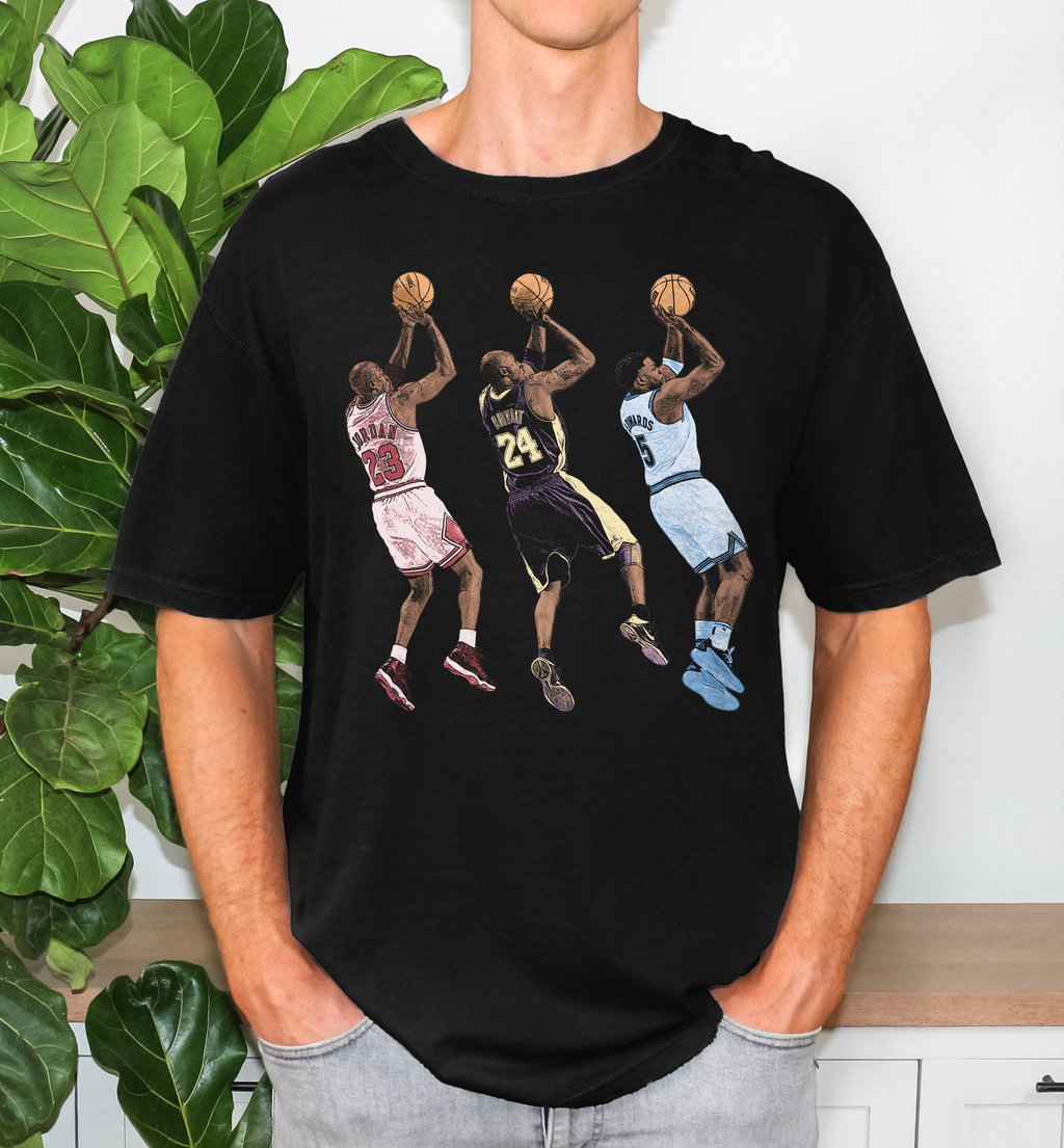 Male wearing an Anthony Edwards Michael Jordan and Kobe Bryant fadeaway jumper graphic tee on Comfort Colors 1717