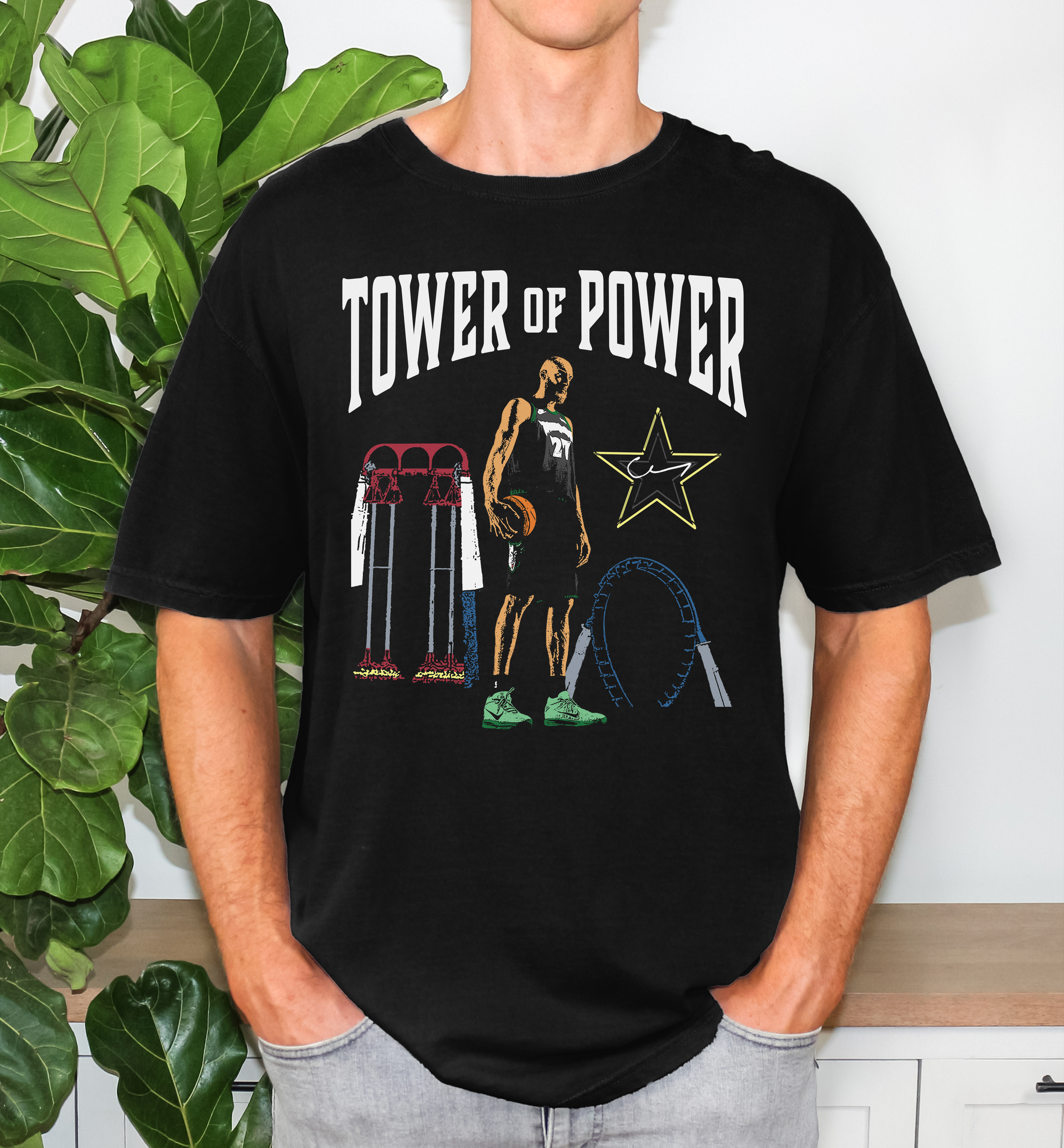 Unisex Comfort Colors t-shirt in black with Tower of Power graphic design on a male model, showing relaxed fit