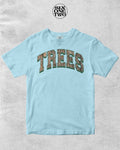 Unisex Comfort Colors t-shirt in light blue with Trees graphic design in a camo