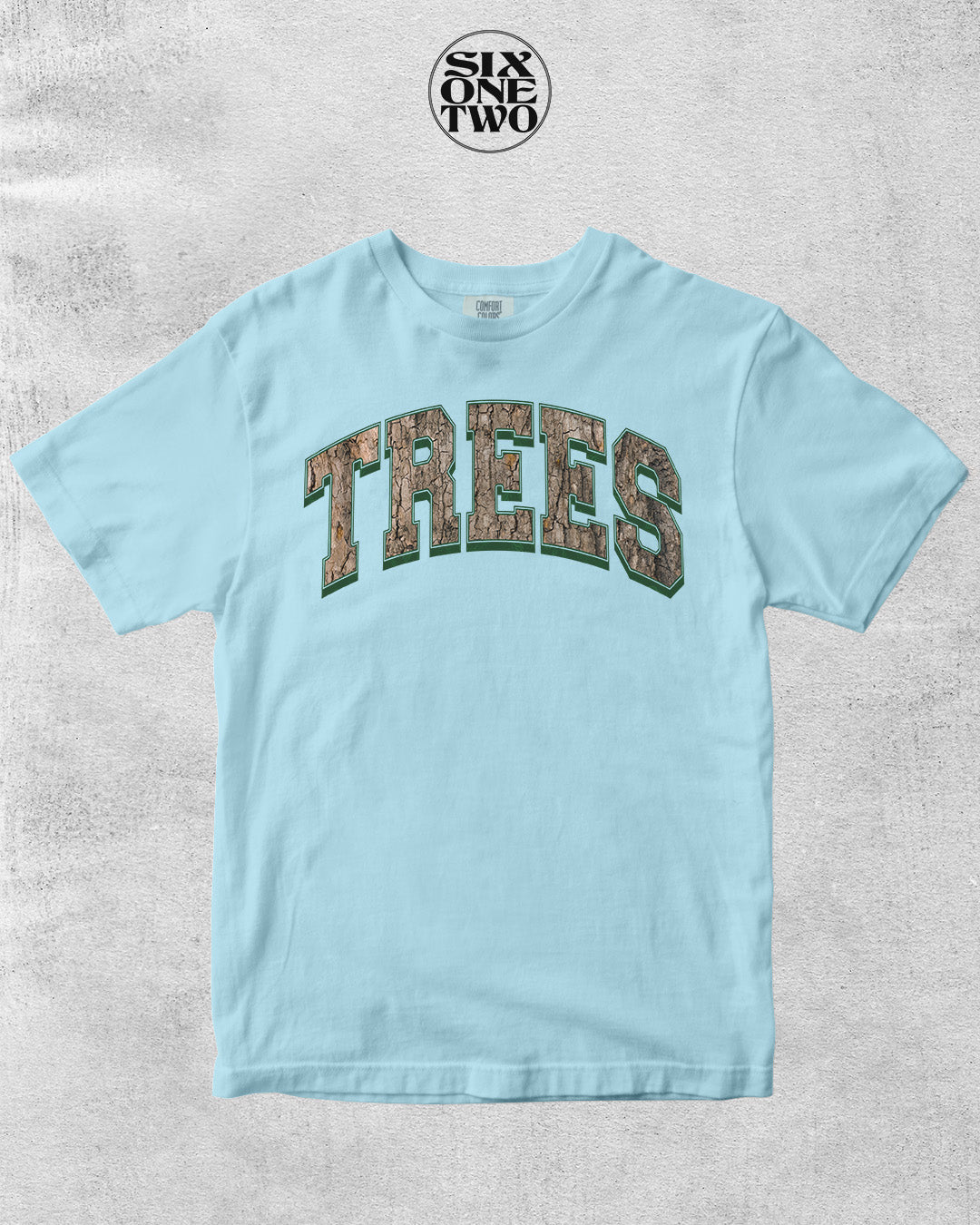 Unisex Comfort Colors t-shirt in light blue with Trees graphic design in a camo