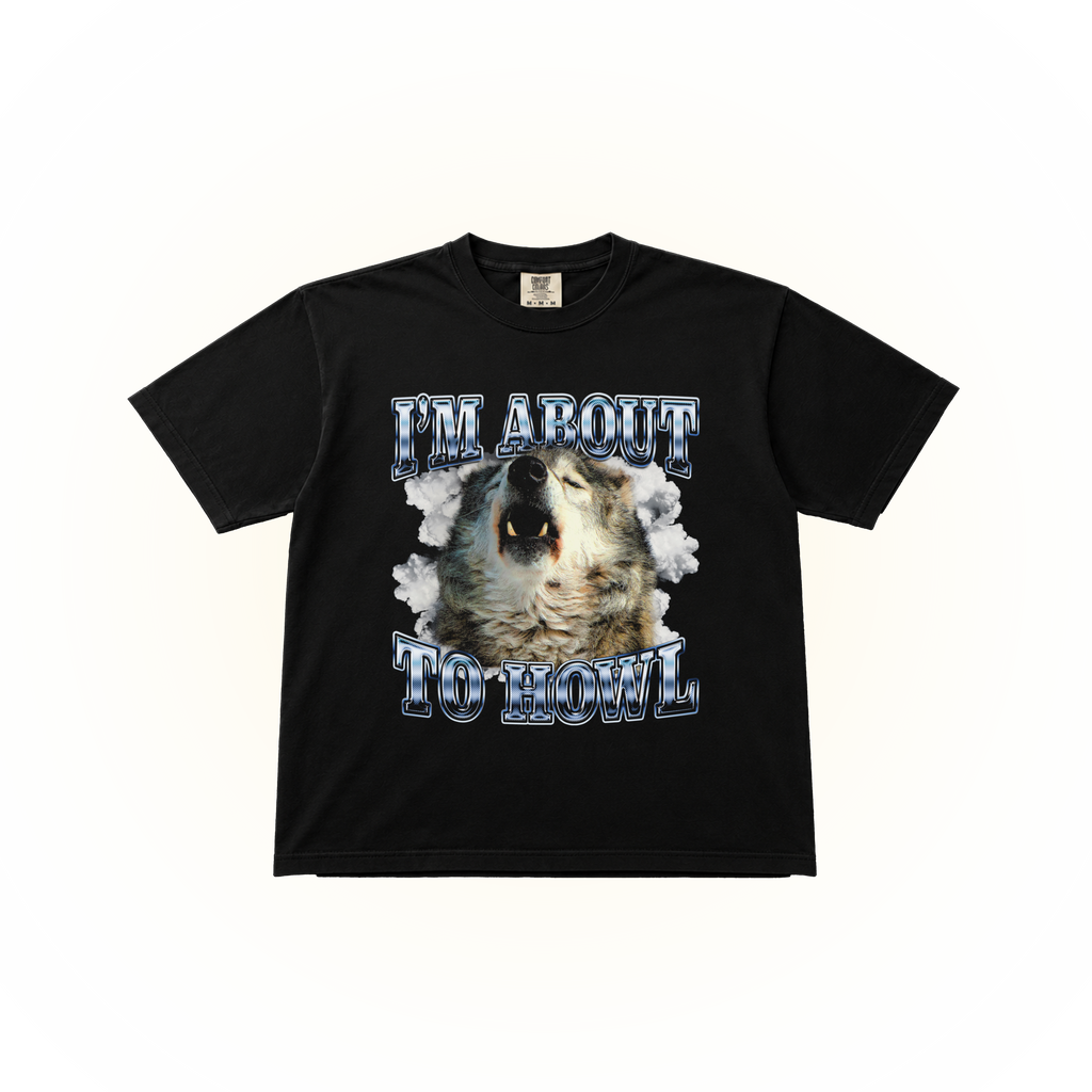 Vintage style wolf graphic on a black Comfort Colors t-shirt saying "I'm about to howl."