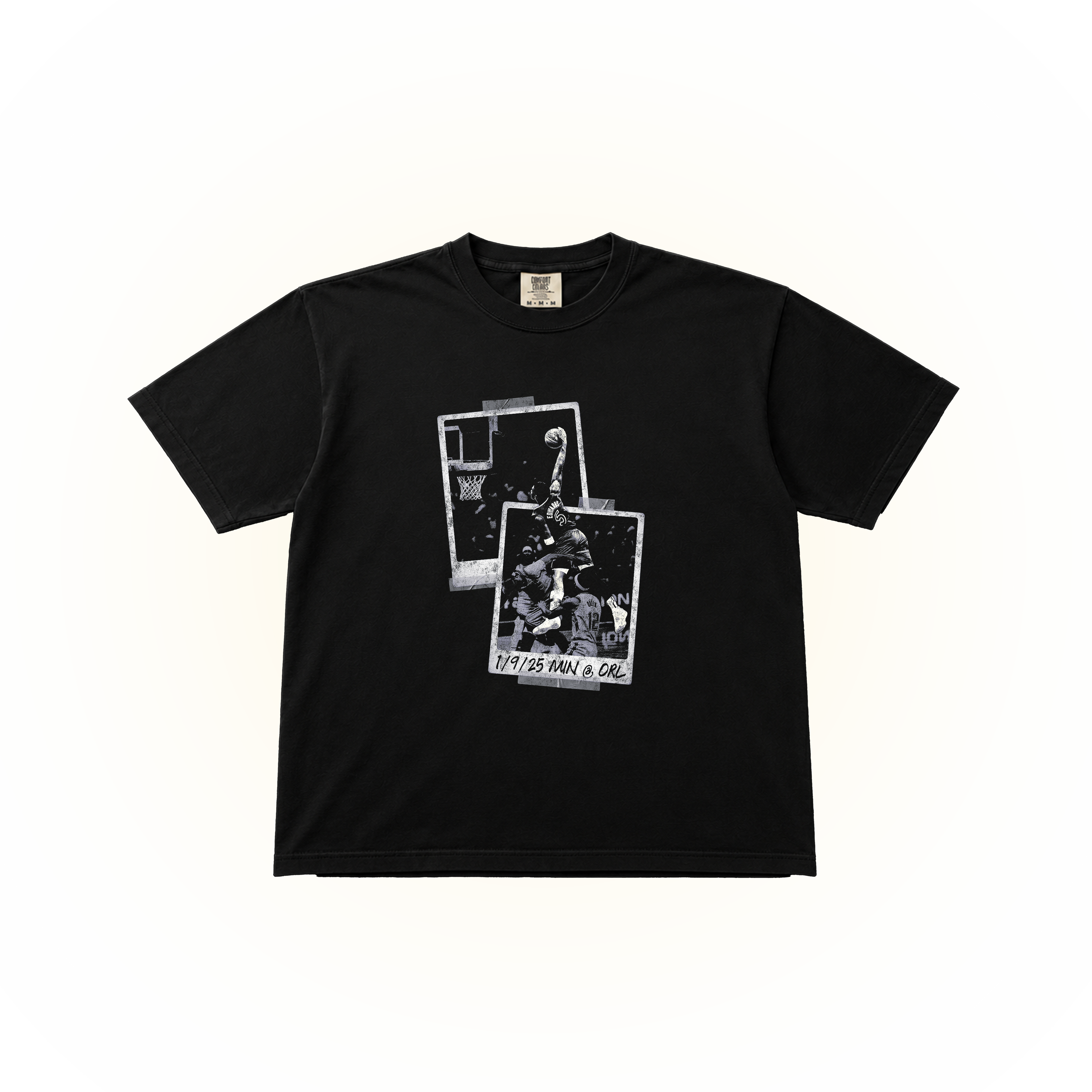 Vintage-style, polaroid picture graphic showing an Anthony Edwards post dunk on 1/9/2025 vs Orlando. This design is on a black Comfort Colors t-shirt