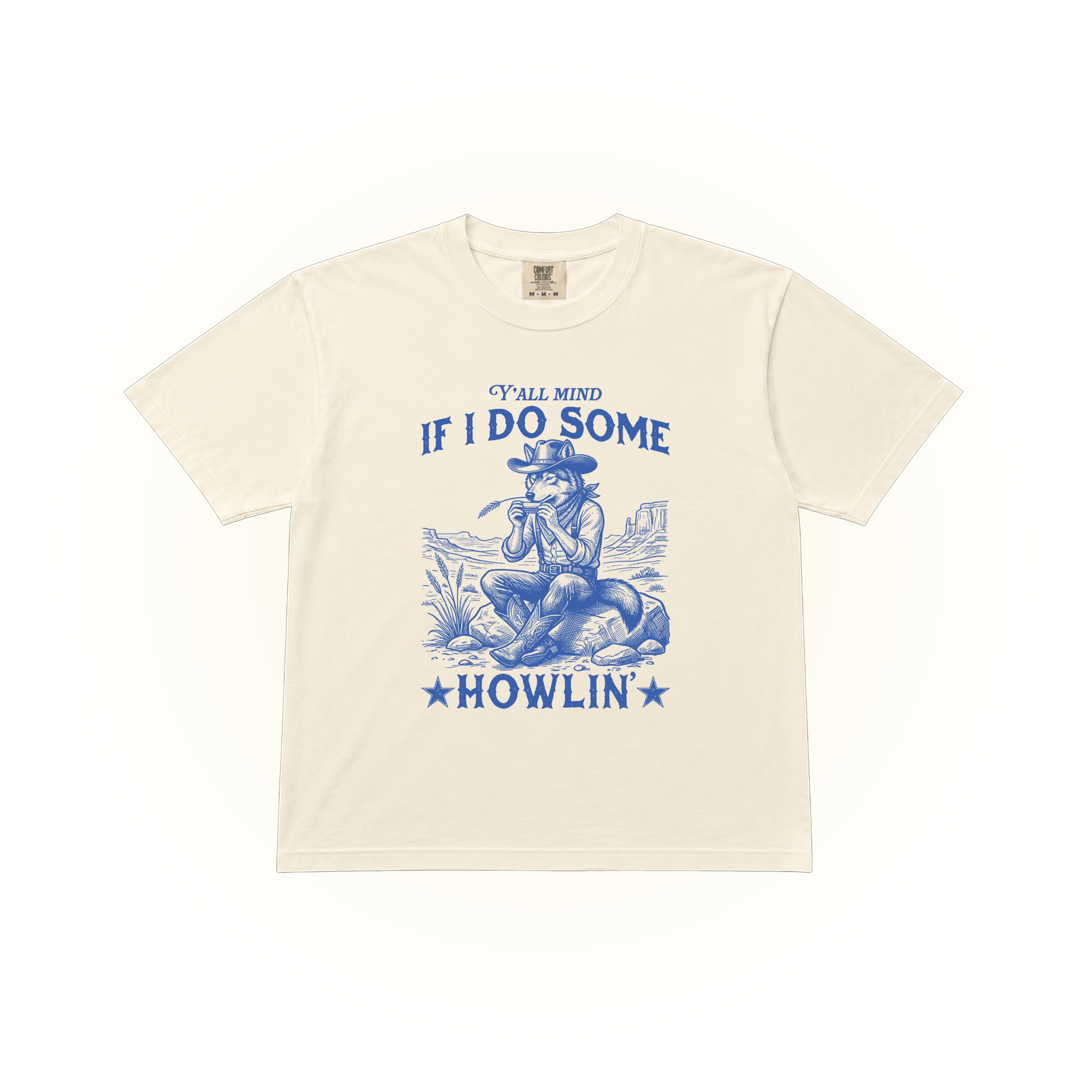 Western style wolf graphic asking "Y'all mind if I do some howling'?" on a ivory Comfort Colors t-shirt